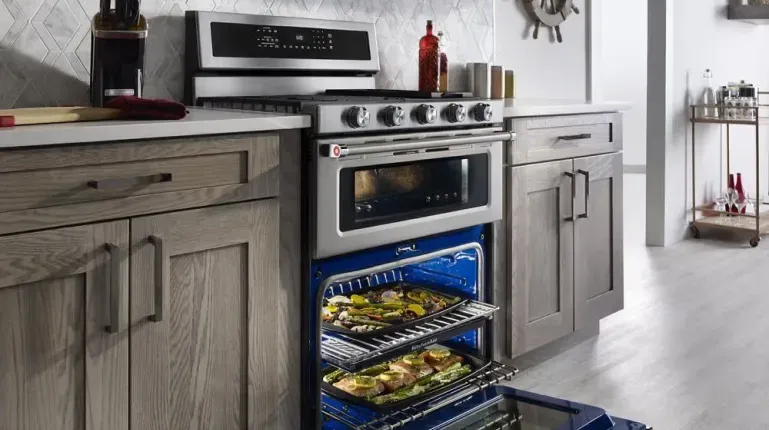 KitchenAid KFDD500ESS double oven range with Even-Heat True Convection and 5 burners for professional multi-dish cooking.